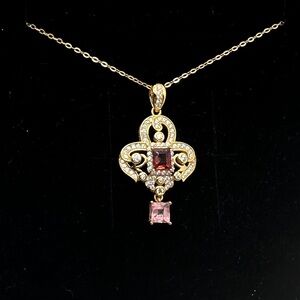 Natural red and pink spinel pendant set in 18 over sterling silver